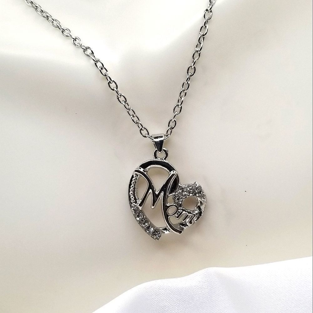 Silver toned chain pendant rhystone mom necklaces.